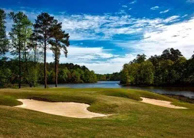 Lakeside view of the vibrant green expanse at Harbour View Golf & Country Club in Gilford, Innisfil, near CozyCotts. The lush grass creates a picturesque backdrop for golfers, enticing them to partake in a round amidst the serene and inviting atmosphere of the course.