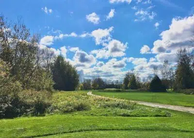 View Golf & Country Club in Gilford, Innisfil, near CozyCotts, as dusk approaches. The serene setting offers a picturesque backdrop for golfers, inviting them to savor a round amidst the tranquil beauty of the course.