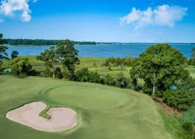 Vivid green expanse at Harbour View Golf & Country Club in Gilford, Innisfil, adjacent to CozyCotts. The lush grass provides a picturesque backdrop for golfers, inviting them to enjoy a round in the serene surroundings of the course.