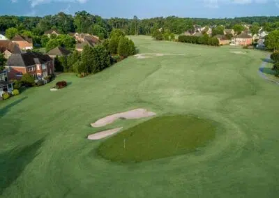 Vivid green expanse at Harbour View Golf & Country Club in Gilford, Innisfil, adjacent to CozyCotts. The lush grass provides a picturesque backdrop for golfers, inviting them to enjoy a round in the serene surroundings of the course.